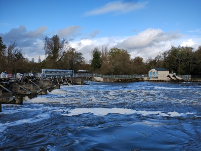 Caversham weir with the hydro plant at the far end. High water flow.