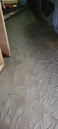 silt on the floor of the turbine house after it flooded
